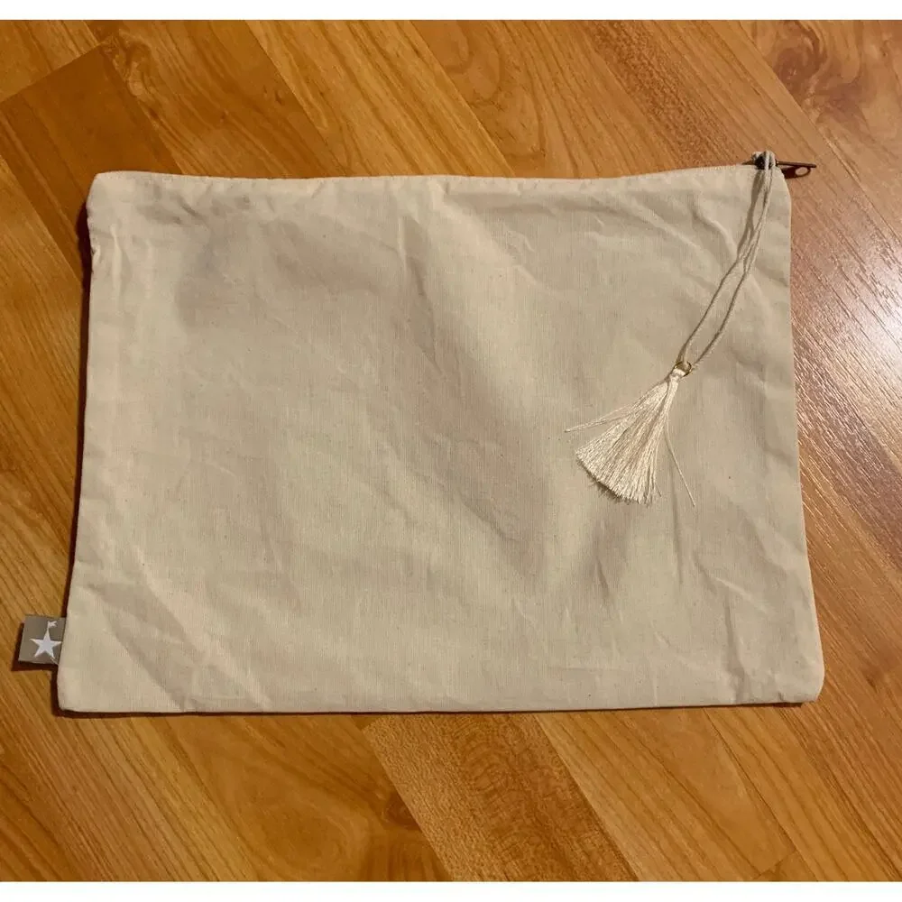 Swimsuit fabric bag with tassel